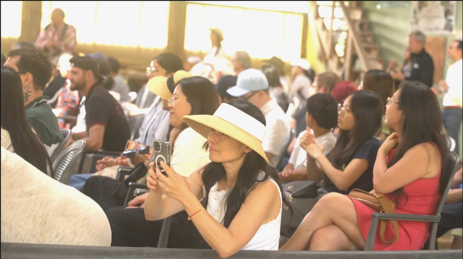 Guests watching the equestrian program inside the barn