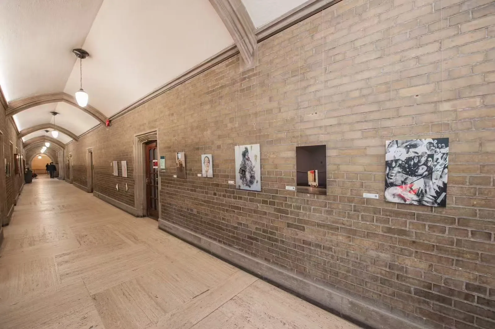 Mixed-media artworks installed along the Hart House corridor