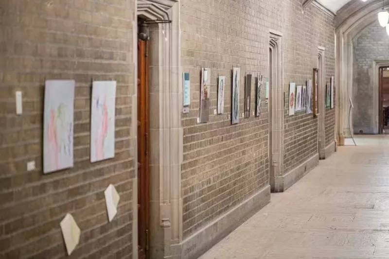 Close installation view of artworks in the corridor