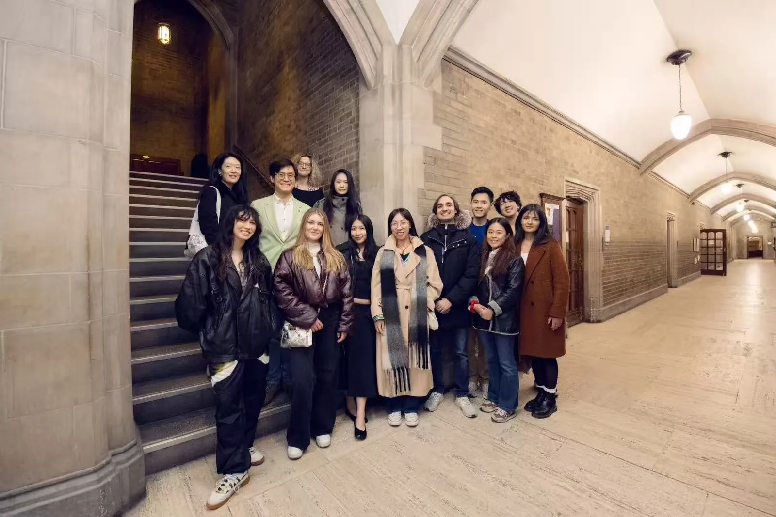 Artists and participants gathered beside the exhibition