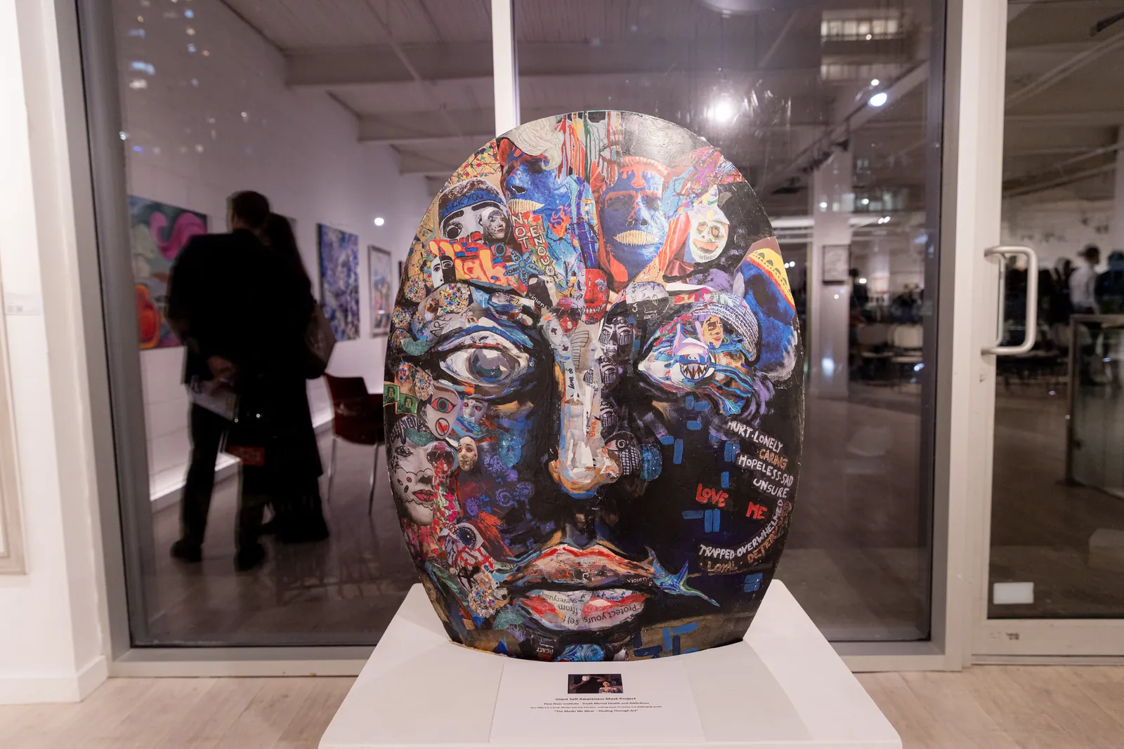 The Giant Self Awareness Mask, a collaged mask sculpture by Pine River Institute youth, displayed at Avant Garde Gallery